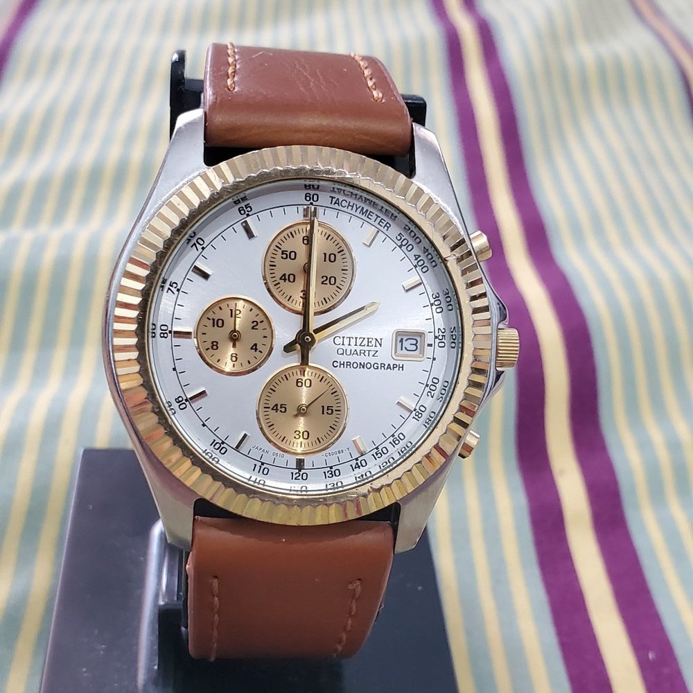 Citizens quartz chronograph gold and tan band